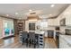An open kitchen includes granite island, stainless appliances, and access to a deck at 35 Valley View, Brownsburg, IN 46112