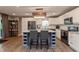 Spacious open kitchen with granite island, wine storage, and stainless steel appliances at 35 Valley View, Brownsburg, IN 46112