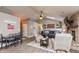 Open-concept living room featuring a brick fireplace, comfortable seating, and a dining table at 35 Valley View, Brownsburg, IN 46112