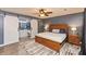 Inviting primary bedroom with a wood bedframe, hardwood floors, and an en-suite bathroom at 35 Valley View, Brownsburg, IN 46112