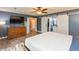 Stylish primary bedroom with hardwood floors, a ceiling fan, and closet barn doors at 35 Valley View, Brownsburg, IN 46112