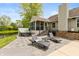Backyard patio featuring a hot tub and lounging area overlooking a scenic pond at 35 Valley View, Brownsburg, IN 46112