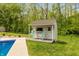 An attractive pool house with a countertop and chairs, perfect for entertaining at 35 Valley View, Brownsburg, IN 46112