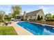 Relax in this backyard oasis featuring a sparkling pool, hot tub, and outdoor seating area for ultimate enjoyment at 35 Valley View, Brownsburg, IN 46112