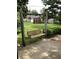 Backyard features a charming wooden swing set, lush green grass, and storage sheds at 3619 31St St, Columbus, IN 47203