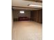 Finished basement area featuring cozy seating, cork flooring, and wood paneled walls at 3619 31St St, Columbus, IN 47203