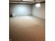 Spacious, unfinished basement featuring neutral walls, lighting, and cork flooring at 3619 31St St, Columbus, IN 47203