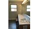 Bathroom with a double vanity and mosaic tiled walls at 3619 31St St, Columbus, IN 47203