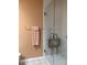 Accessible bathroom features a tiled shower with fold-down seat and grab bars at 3619 31St St, Columbus, IN 47203