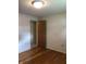 Bedroom with hardwood floors, neutral walls, and access to additional room at 3619 31St St, Columbus, IN 47203