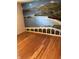 Charming bedroom featuring hardwood floors and a scenic beach mural wall at 3619 31St St, Columbus, IN 47203