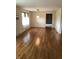 Hardwood floors flow through a dining area, creating an inviting space for meals and gatherings at 3619 31St St, Columbus, IN 47203