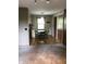 View of dining room, with hardwood floors and a charming light fixture above a round table at 3619 31St St, Columbus, IN 47203