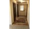 Inviting entryway features hardwood floors, a decorative rug, and dark wood closet doors at 3619 31St St, Columbus, IN 47203