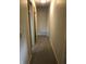 Hallway view with carpet flooring and doors at 3619 31St St, Columbus, IN 47203