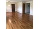 Spacious living room with beautiful hardwood floors, white walls, and neutral accents at 3619 31St St, Columbus, IN 47203