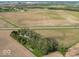Expansive aerial view of the property, highlighting its serene setting nestled between cultivated fields at 3868 E Worthsville Rd, Whiteland, IN 46184