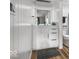 Bright bathroom featuring white cabinets, a sleek mirror, and a dark gray floor mat at 3868 E Worthsville Rd, Whiteland, IN 46184