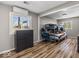 Well-lit bedroom with wood floors, a large window, and comfortable furnishings at 3868 E Worthsville Rd, Whiteland, IN 46184