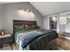 Spacious bedroom with a modern bed frame and lighting. It also has a walk-in closet at 3868 E Worthsville Rd, Whiteland, IN 46184