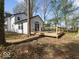 Cozy wooden deck perfect for outdoor relaxation, seamlessly connecting to the home's interior at 3868 E Worthsville Rd, Whiteland, IN 46184