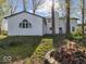 Exterior view of a home with a charming backyard fire pit area, perfect for outdoor entertaining at 3868 E Worthsville Rd, Whiteland, IN 46184