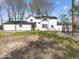 Beautiful home exterior with manicured lawn and black-framed windows, showcasing modern design elements at 3868 E Worthsville Rd, Whiteland, IN 46184