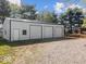 Spacious three-car garage with ample parking and storage space at 3868 E Worthsville Rd, Whiteland, IN 46184