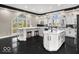 Beautiful kitchen with large windows, custom cabinets, and plenty of natural light at 3868 E Worthsville Rd, Whiteland, IN 46184