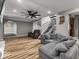 Open-concept living room with hardwood floors, recessed lighting, and comfortable seating at 3868 E Worthsville Rd, Whiteland, IN 46184