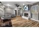 Cozy living room with a fireplace, ceiling fan, and comfortable seating at 3868 E Worthsville Rd, Whiteland, IN 46184