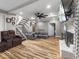 Spacious living room featuring a fireplace, hardwood floors, and plenty of natural light at 3868 E Worthsville Rd, Whiteland, IN 46184