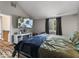 Spacious main bedroom featuring a large bed and entertainment center with a wall-mounted TV at 3868 E Worthsville Rd, Whiteland, IN 46184
