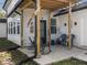 Inviting covered porch featuring comfortable seating, decorative accents, and a welcoming entrance at 3868 E Worthsville Rd, Whiteland, IN 46184