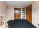 Room needing renovation with unfinished walls, black floors and a cat tree at 3868 E Worthsville Rd, Whiteland, IN 46184
