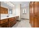 Bathroom features a wood vanity with a laminate countertop and private toilet area at 40 Clear Spring Ln, Trafalgar, IN 46181