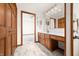 Bathroom with wood vanity, built-in vanity, and large closet or linen storage at 40 Clear Spring Ln, Trafalgar, IN 46181