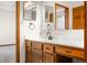 Bathroom boasts wood cabinets, a white countertop, and convenient vanity seating at 40 Clear Spring Ln, Trafalgar, IN 46181