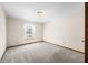 This carpeted bedroom has neutral walls, a ceiling light, and a window at 40 Clear Spring Ln, Trafalgar, IN 46181