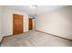 This carpeted bedroom features wood trim and doors and light walls at 40 Clear Spring Ln, Trafalgar, IN 46181