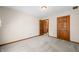 This carpeted bedroom features wood trim and doors and light walls at 40 Clear Spring Ln, Trafalgar, IN 46181
