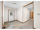 Bright foyer features tile flooring, wooden trim, and provides access to other rooms in the house at 40 Clear Spring Ln, Trafalgar, IN 46181