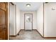 Welcoming entryway with decorative glass door and neutral tile flooring for a bright and inviting feel at 40 Clear Spring Ln, Trafalgar, IN 46181