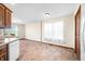 Open floor plan showcasing the kitchen area with wooden cabinets and bright natural lighting at 40 Clear Spring Ln, Trafalgar, IN 46181