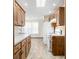 Well-lit kitchen features oak cabinets, white appliances, and ample counter space at 40 Clear Spring Ln, Trafalgar, IN 46181