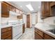 Traditional kitchen features wood cabinets, a gas range, and laminate countertops at 40 Clear Spring Ln, Trafalgar, IN 46181