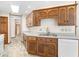 Bright kitchen with wooden cabinets, ample counter space, and modern appliances at 40 Clear Spring Ln, Trafalgar, IN 46181