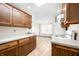 A kitchen featuring wood cabinets, white appliances, and ample counter space at 40 Clear Spring Ln, Trafalgar, IN 46181