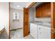 Convenient laundry room and half bath combination features a window and storage at 40 Clear Spring Ln, Trafalgar, IN 46181