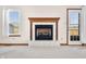 Close up of the cozy fireplace, window and backyard access to a outdoor patio at 40 Clear Spring Ln, Trafalgar, IN 46181